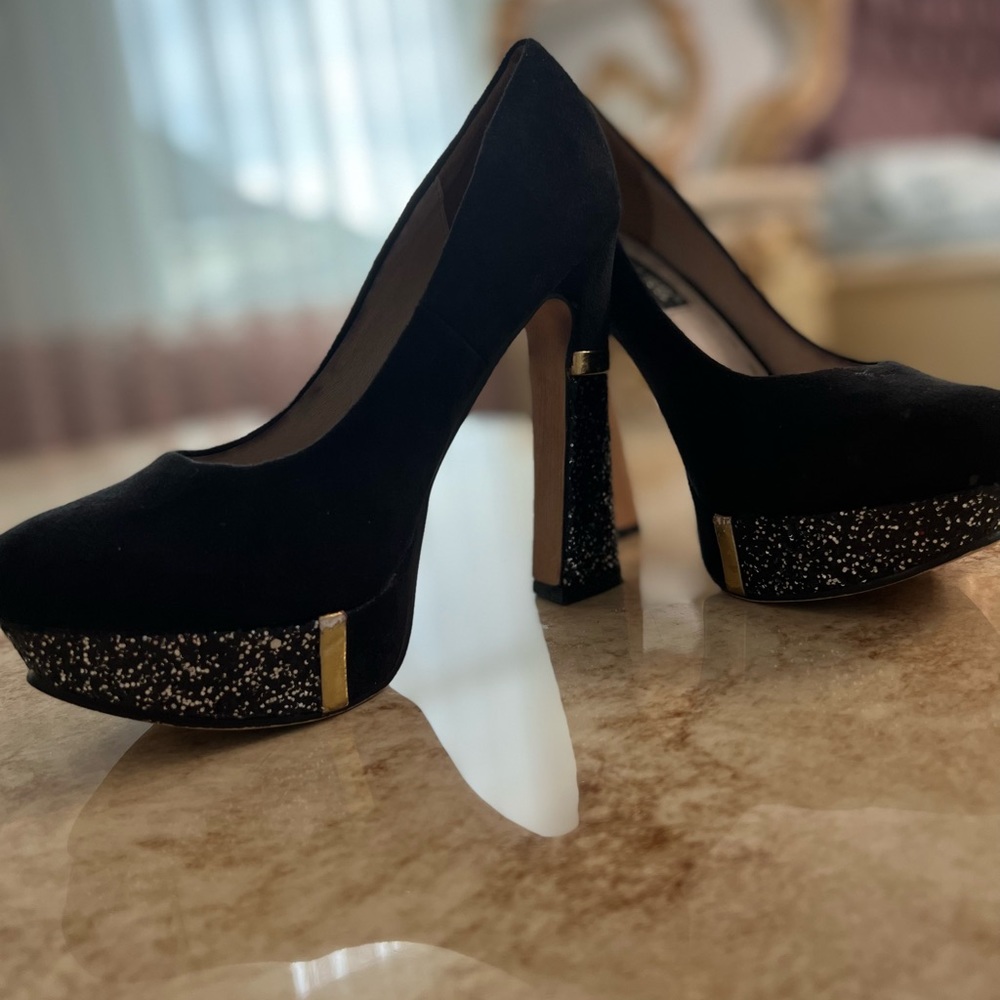 Gold and black heels